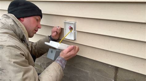 access electrical box after vinyl siding installed|vinyl siding exterior outlet installation.